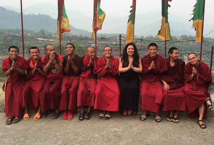 Dr. Naini posing with budhist monks
