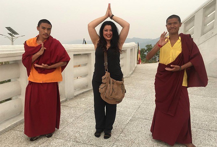 Dr. Naini posing with monks