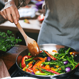 a person cooking a healthy meal