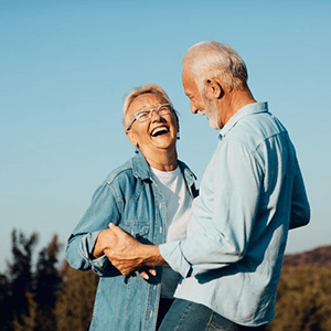 a mature couple with dentures spending time together