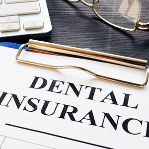 paperwork representing dental insurance coverage for dentures