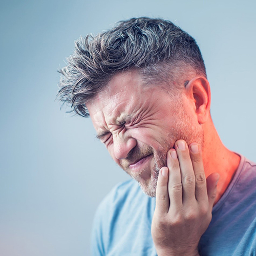 a man suffering from a toothache