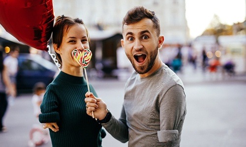 a person biting into a lollipop