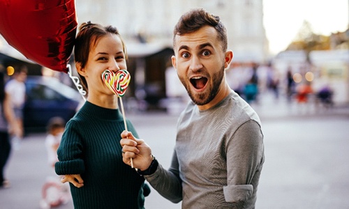 couple smiling at a fair