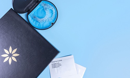 an Invisalign starter packet with trays and a folder of information