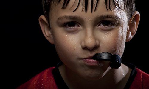 Child holding mouthguard