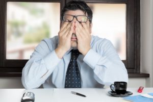 man struggling to stay awake