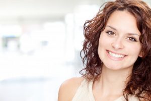 woman smiling brunette perfect teeth