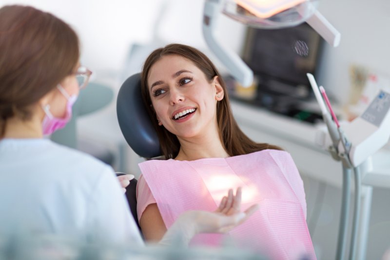 person discussing sensitivity in dental implants with dentist