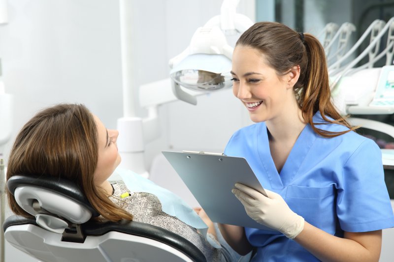 person speaking with cosmetic dentist