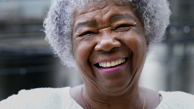 smiling older person wearing dentures